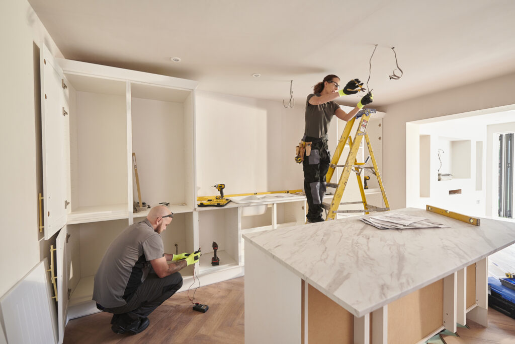 Workers rehabbing an investment property after getting a rehab loan