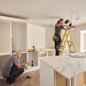 Workers rehabbing an investment property after getting a rehab loan