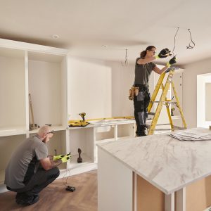 Workers rehabbing an investment property after getting a rehab loan