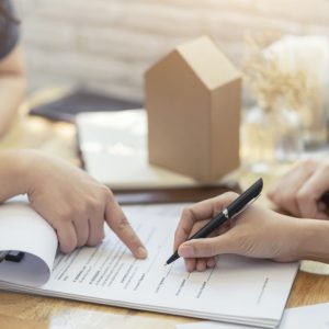 Woman signing paper